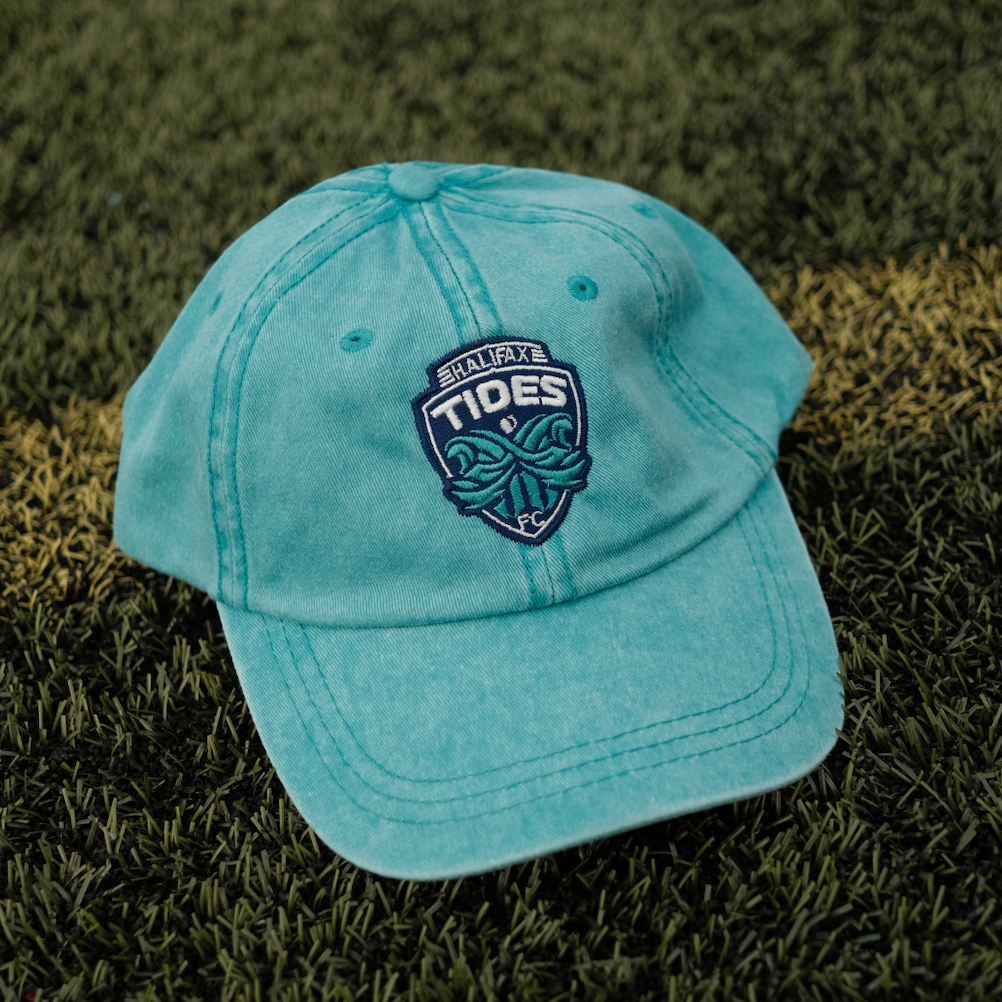 Light Blue Halifax Tides FC Crested Dad Hat on soccer pitch