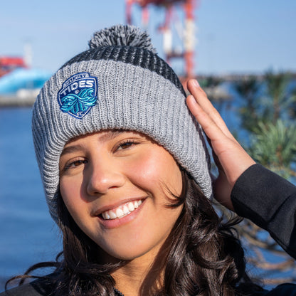 Girl wear pom pom hat by harbour