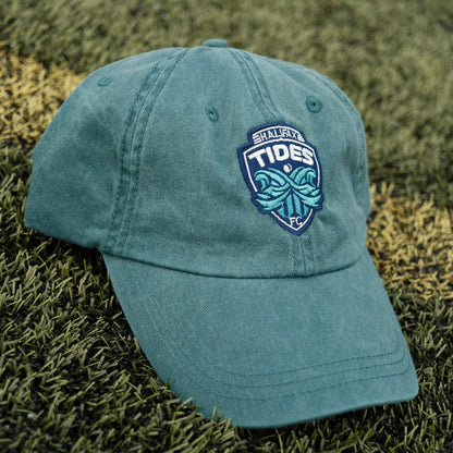 Teal Halifax Tides FC Crested Dad Hat on soccer pitch